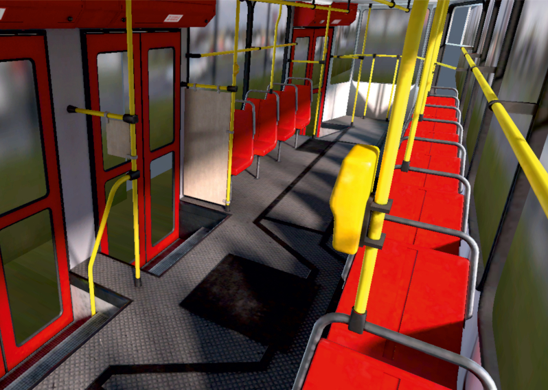Wnętrze tramwaju. Czerwone krzesła, żółte poręcze, przesuwne drzwi wejściowe